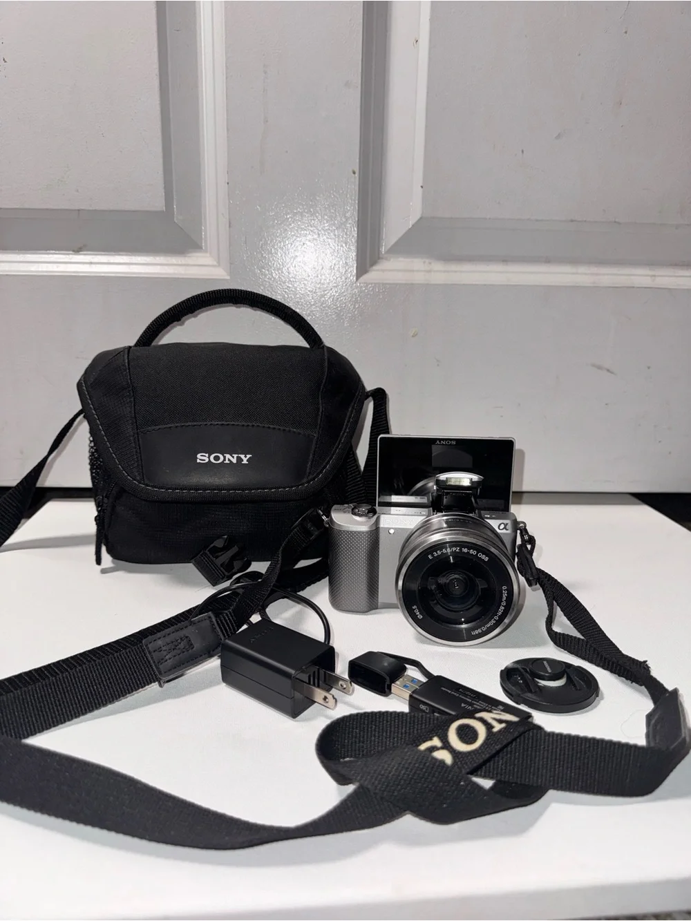 Sony A5000 Silver Mirrorless Camera with Black Carry Case and accessories